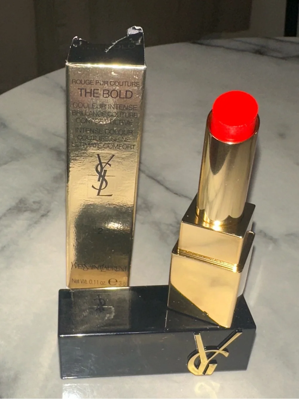 Yves Saint Laurent Gold & Black Tube Lipstick — Bright Red color “Wilful Red.”